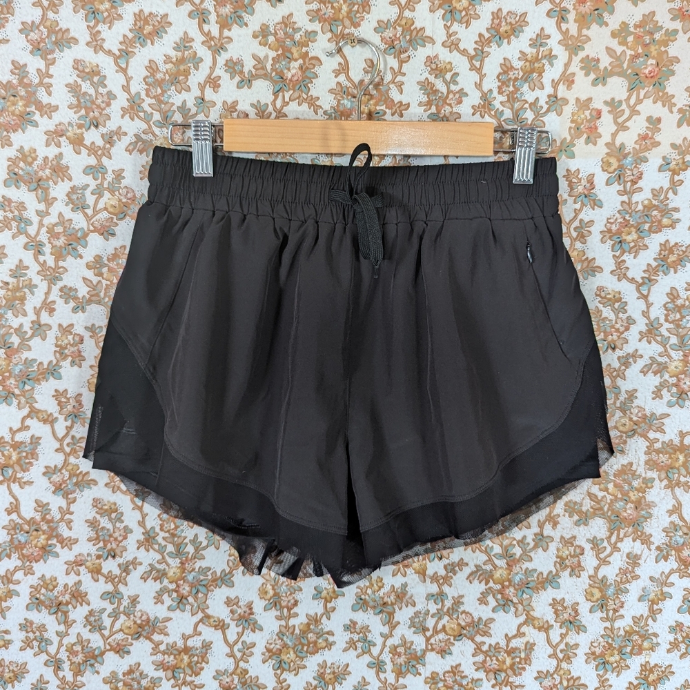 Black running shorts with built in bike shorts and zip pocket